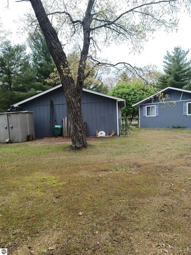 4440 M-65, Oscoda, MI 48750 - view of green lawn with an outbuilding