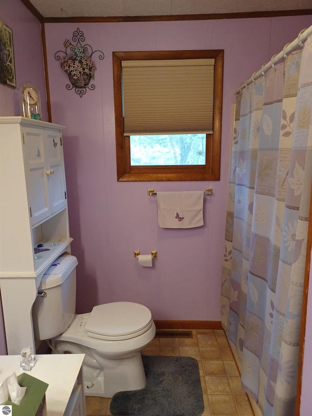 4440 M-65, Oscoda, MI 48750 - bathroom featuring toilet, vanity, baseboards, tile patterned flooring, and a shower with shower curtain