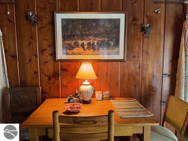 951 Lake Dr, Harrison, MI 48625 - dining space featuring wood walls