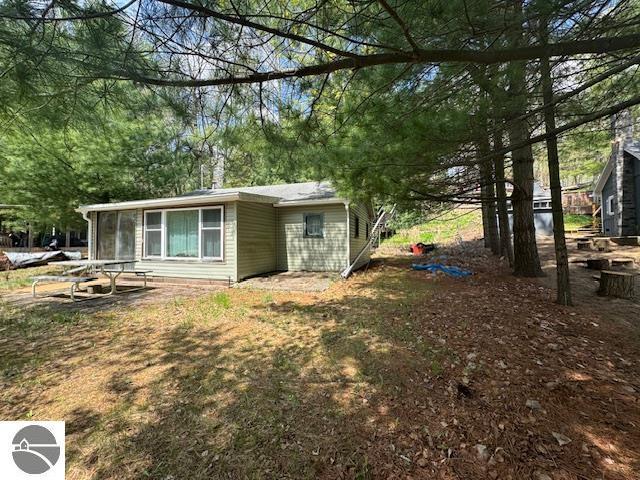 951 Lake Dr, Harrison, MI 48625 - view of home's exterior with a sunroom