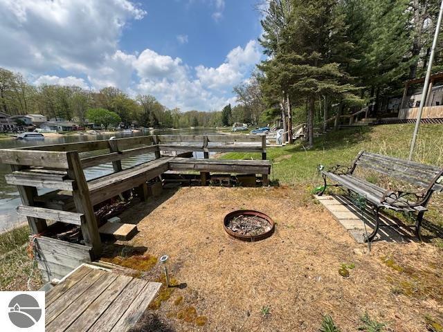 951 Lake Dr, Harrison, MI 48625 - view of community with a yard