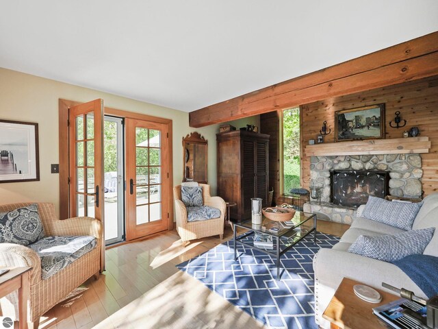 1321 N Manitou Trl, Leland, MI 49654 - living area with wood finished floors and a stone fireplace
