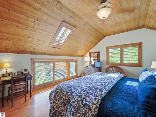 1321 N Manitou Trl, Leland, MI 49654 - bedroom with wood ceiling, vaulted ceiling, light wood-style flooring, and multiple windows