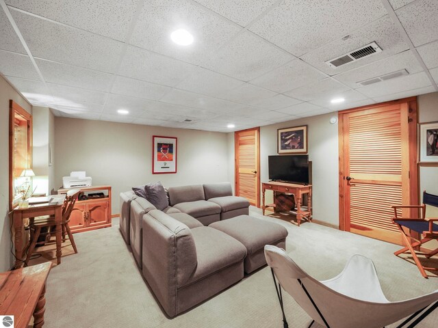 1321 N Manitou Trl, Leland, MI 49654 - living room with light colored carpet, a drop ceiling, recessed lighting, and baseboards