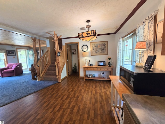 1470 N Al Moses Rd, Lake City, MI 49651 - dining room featuring wood finished floors, a textured ceiling, stairs, crown molding, and baseboards