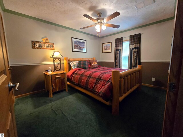 1470 N Al Moses Rd, Lake City, MI 49651 - bedroom featuring baseboards, ornamental molding, dark carpet, a textured ceiling, and a ceiling fan
