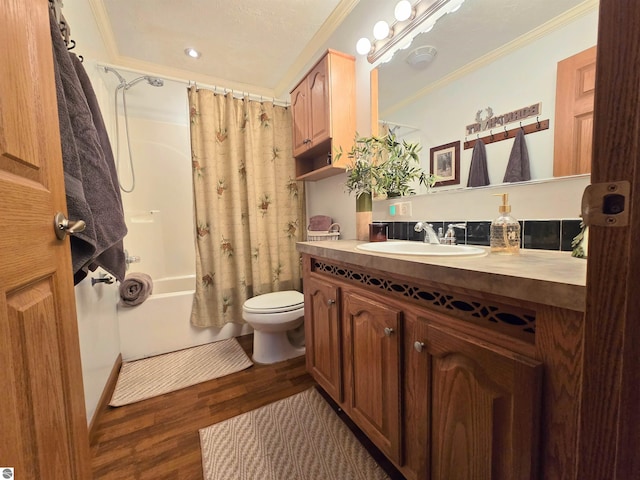 1470 N Al Moses Rd, Lake City, MI 49651 - full bath with crown molding, wood finished floors, vanity, toilet, and shower / bath combo