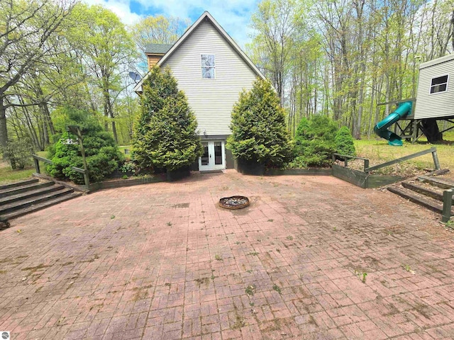 1470 N Al Moses Rd, Lake City, MI 49651 - view of patio / terrace with french doors and an outdoor fire pit