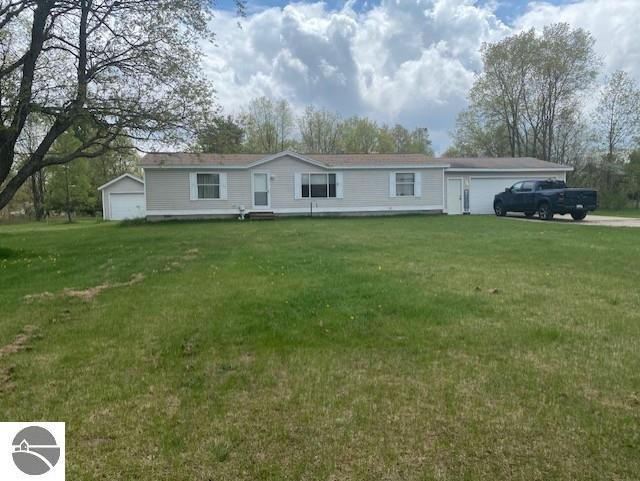 10559 Rosted Rd, Lake City, MI 49651 - view of front of home with a front lawn and a garage