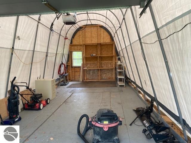 10559 Rosted Rd, Lake City, MI 49651 - garage featuring a garage door opener