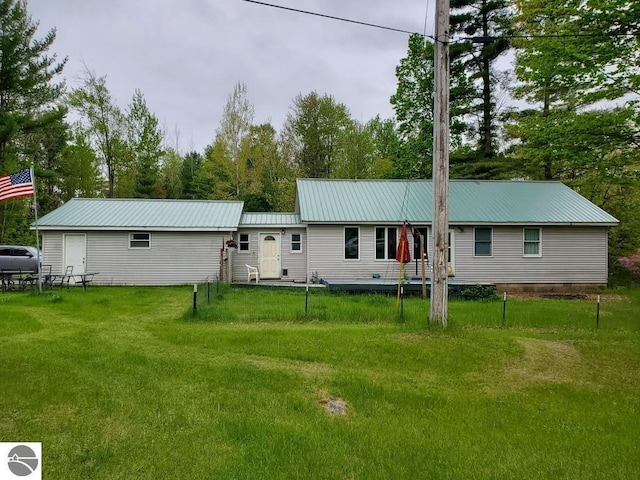 1148 Horseshoe Dr, Alger, MI 48610 - single story home with metal roof and a front yard