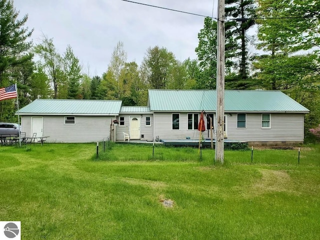 1148 Horseshoe Dr, Alger, MI 48610 - view of front of home with metal roof and a front lawn