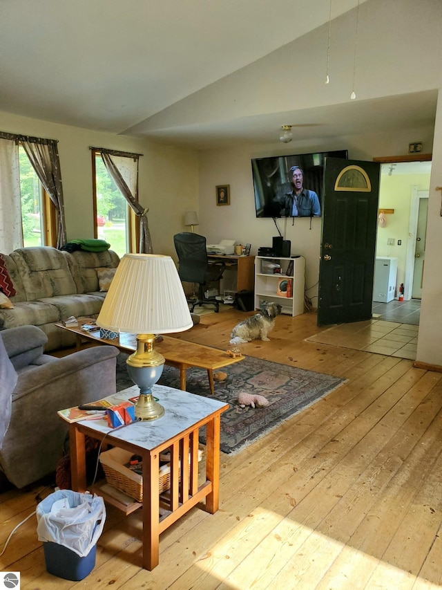 1148 Horseshoe Dr, Alger, MI 48610 - living area with vaulted ceiling and hardwood / wood-style floors