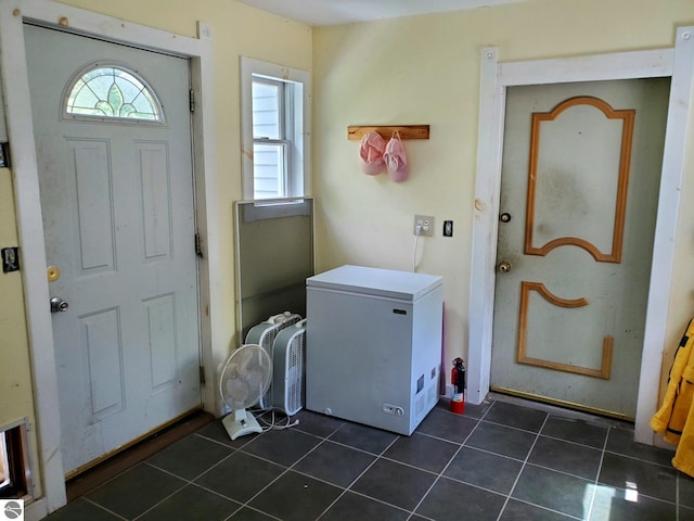 1148 Horseshoe Dr, Alger, MI 48610 - laundry room featuring dark tile patterned flooring