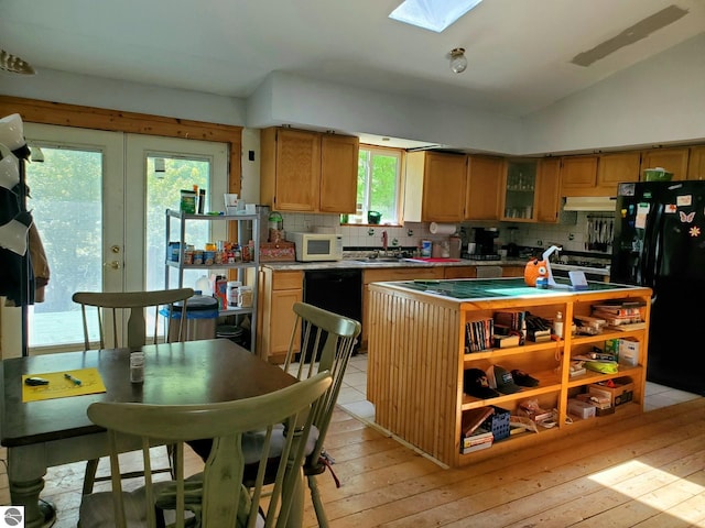 1148 Horseshoe Dr, Alger, MI 48610 - kitchen with black appliances, under cabinet range hood, a sink, tasteful backsplash, and vaulted ceiling