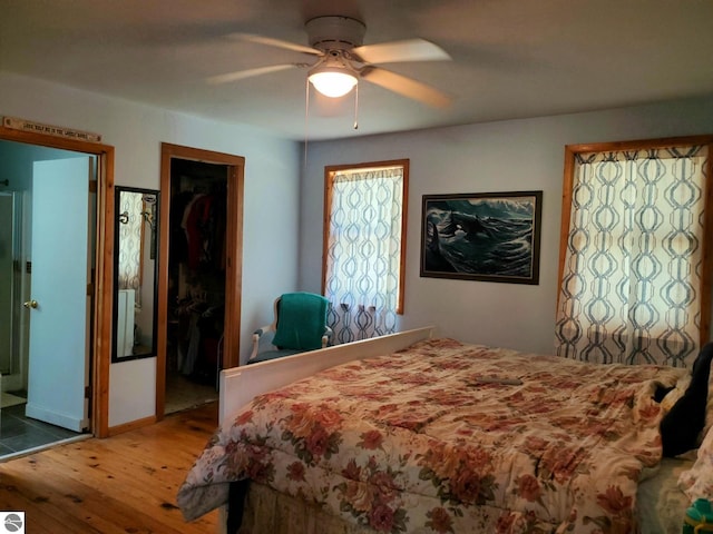 1148 Horseshoe Dr, Alger, MI 48610 - bedroom with wood-type flooring and a ceiling fan