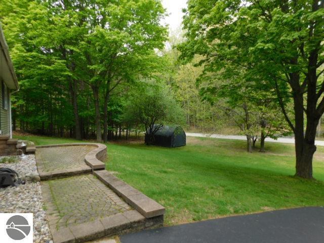 12149 Cabin Ln, Rapid City, MI 49676 - view of grassy yard