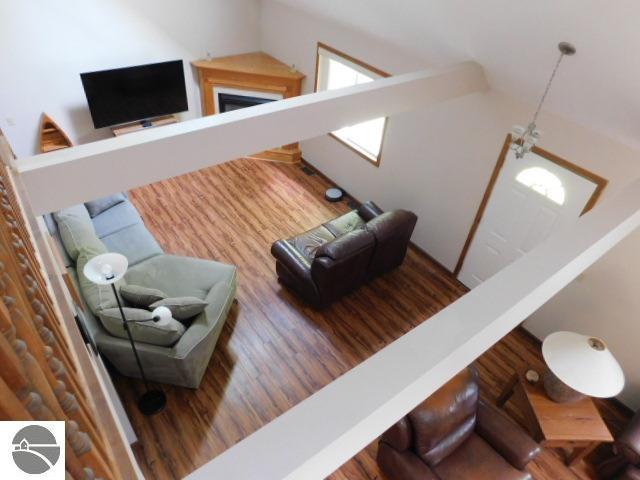 12149 Cabin Ln, Rapid City, MI 49676 - living room featuring wood finished floors