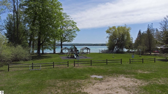12149 Cabin Ln, Rapid City, MI 49676 - view of yard with a playground and a water view