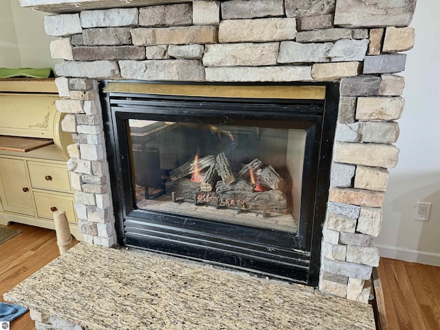2442 Joseph Dr, Mount Pleasant, MI 48858 - detailed view of a fireplace and wood finished floors