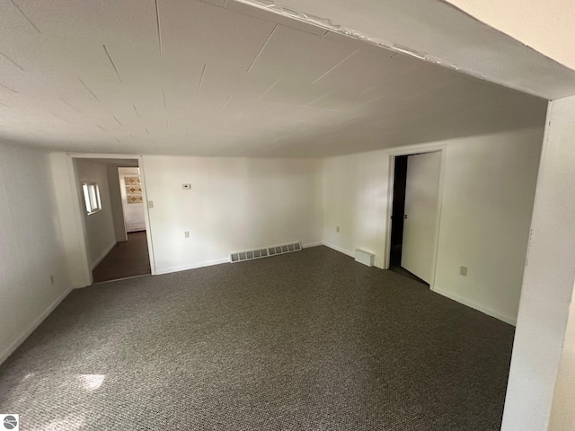 1007 Park St, Mount Pleasant, MI 48858 - empty room with dark colored carpet and baseboards