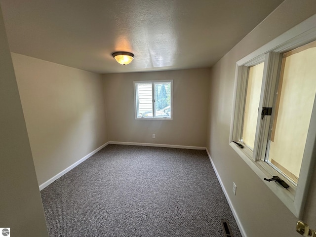 1007 Park St, Mount Pleasant, MI 48858 - spare room with carpet and baseboards