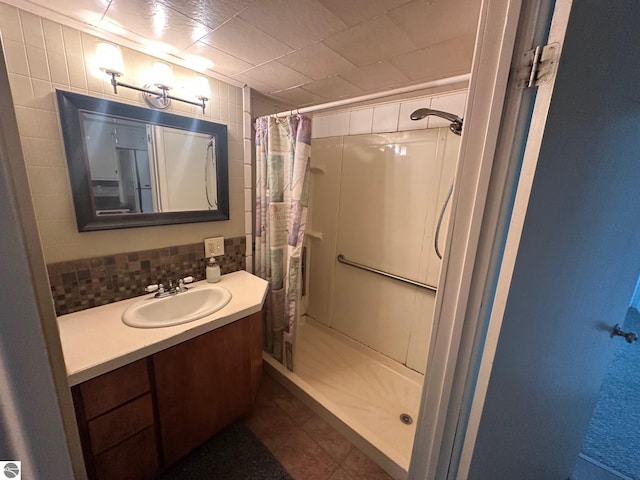 1007 Park St, Mount Pleasant, MI 48858 - bathroom featuring a stall shower, vanity, and tile patterned floors