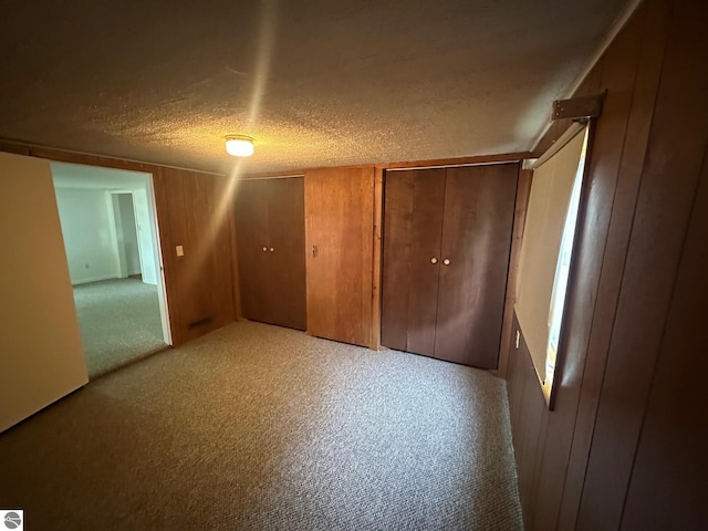 1007 Park St, Mount Pleasant, MI 48858 - unfurnished bedroom featuring a textured ceiling and carpet
