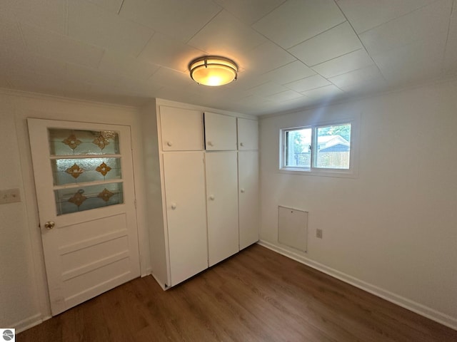 1007 Park St, Mount Pleasant, MI 48858 - unfurnished bedroom with wood finished floors, a closet, and baseboards