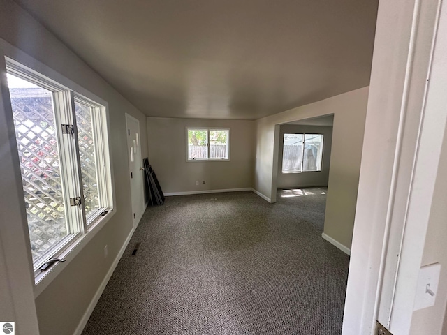 1007 Park St, Mount Pleasant, MI 48858 - carpeted spare room featuring baseboards