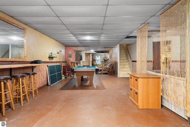 11567 Lake Valley Rd, Kalkaska, MI 49646 - recreation room with billiards table, a drop ceiling, finished concrete floors, and bar
