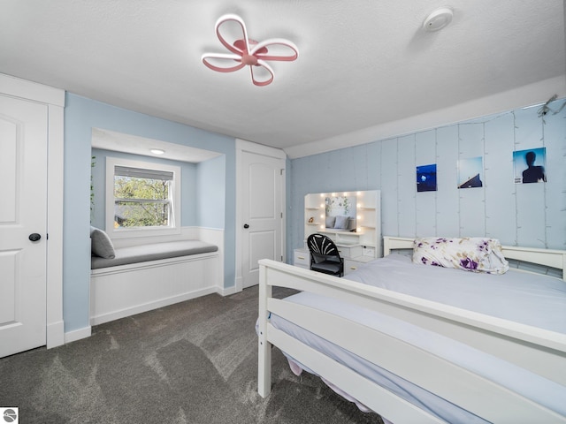 855 E State St, Traverse City, MI 49686 - bedroom with dark colored carpet and baseboards