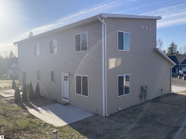9286 S Flaska Dr Unit 12, Cedar, MI 49621 - back of property with a patio area