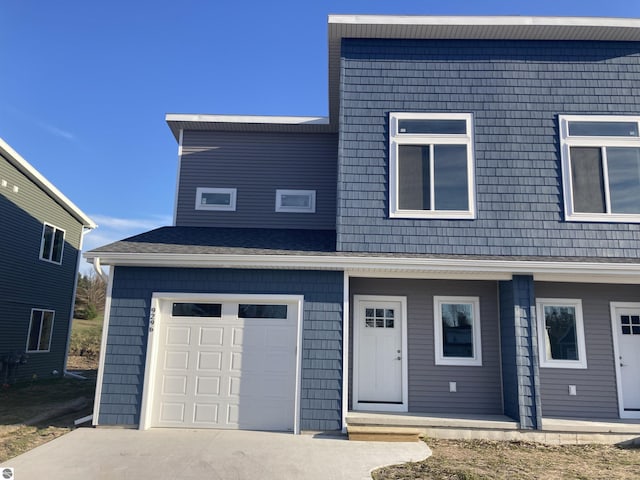 9296 S Flaska Dr Unit 14, Cedar, MI 49621 - view of front of home featuring concrete driveway