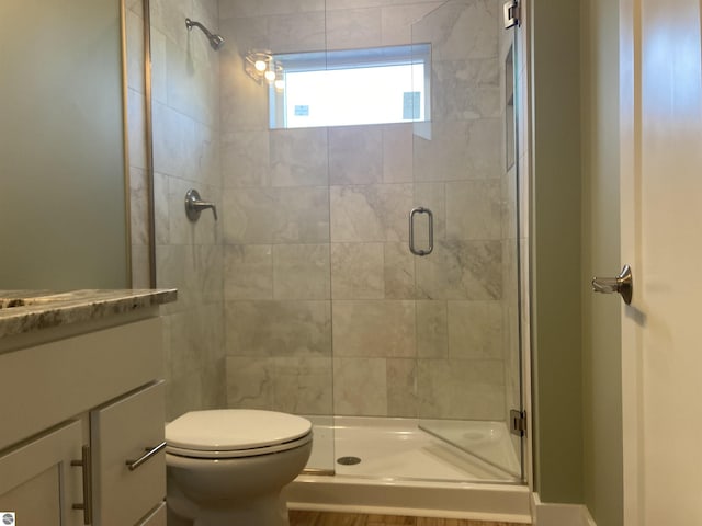 9296 S Flaska Dr Unit 14, Cedar, MI 49621 - bathroom with a shower stall, toilet, and vanity