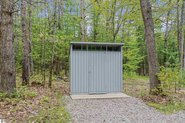 145 Fisher Rd, Traverse City, MI 49685 - view of shed with a view of trees