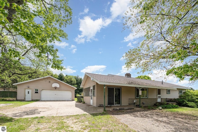 6770 N Crystal, Vestaburg, MI 48891 - view of front of home with a garage, an outdoor structure, and a chimney