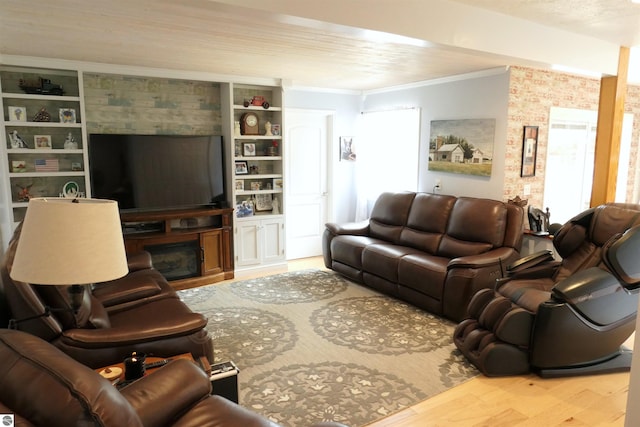 505 Eaton St, Breckenridge, MI 48615 - living area with crown molding, wood finished floors, a glass covered fireplace, and built in features