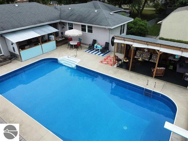 505 Eaton St, Breckenridge, MI 48615 - swimming pool with a patio area and a diving board