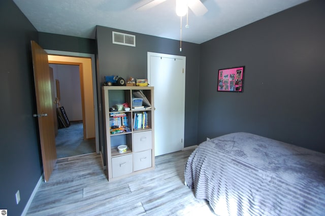 1137 Stoney Ridge Rd, West Branch, MI 48661 - bedroom featuring wood finished floors, baseboards, and a ceiling fan
