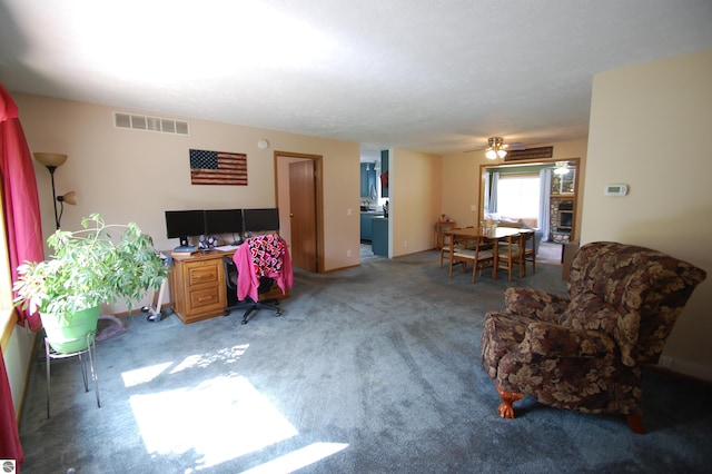 1137 Stoney Ridge Rd, West Branch, MI 48661 - living area with carpet, ceiling fan, and an office area