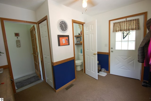 1137 Stoney Ridge Rd, West Branch, MI 48661 - foyer entrance with a ceiling fan and carpet