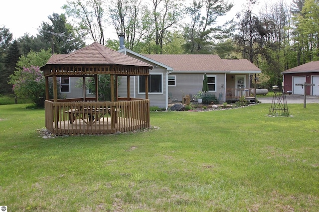 1137 Stoney Ridge Rd, West Branch, MI 48661 - back of house featuring a gazebo, a yard, roof with shingles, and a wooden deck