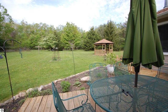 1137 Stoney Ridge Rd, West Branch, MI 48661 - view of grassy yard featuring a gazebo, outdoor dining space, and a deck