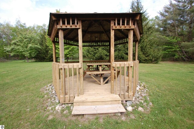 1137 Stoney Ridge Rd, West Branch, MI 48661 - wooden terrace featuring a gazebo and a lawn