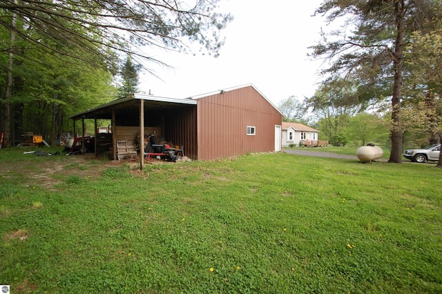 1137 Stoney Ridge Rd, West Branch, MI 48661 - view of pole building with a lawn and driveway