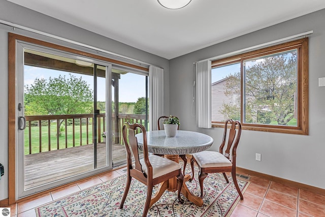 2683 Green Meadows Dr Unit 10, Traverse City, MI 49685 - dining room featuring light tile patterned floors and baseboards