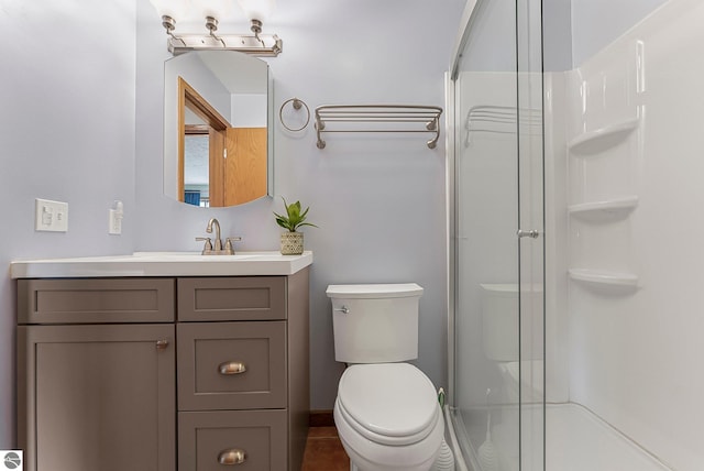 2683 Green Meadows Dr Unit 10, Traverse City, MI 49685 - bathroom featuring an enclosed shower, vanity, and toilet