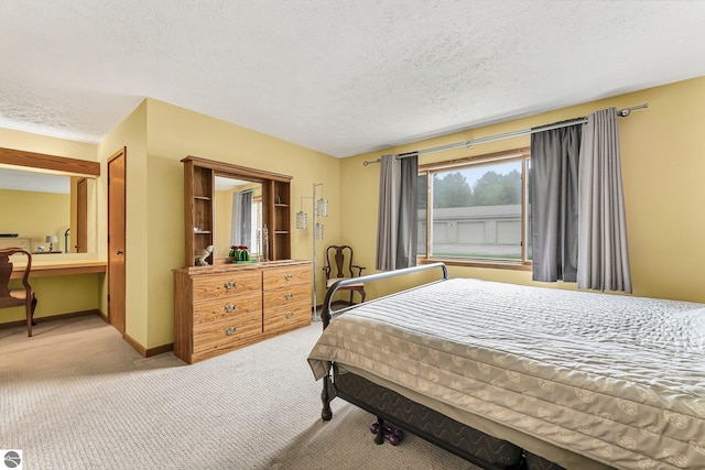 2683 Green Meadows Dr Unit 10, Traverse City, MI 49685 - carpeted bedroom with a textured ceiling and baseboards