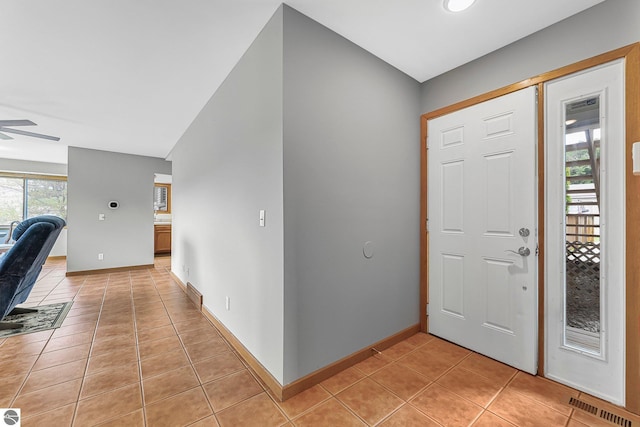 2683 Green Meadows Dr Unit 10, Traverse City, MI 49685 - foyer with light tile patterned flooring, baseboards, and a ceiling fan